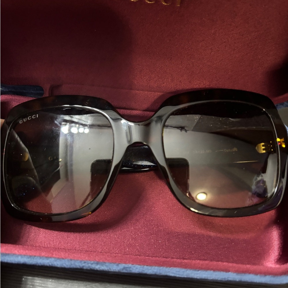 Blue and red Gucci glasses